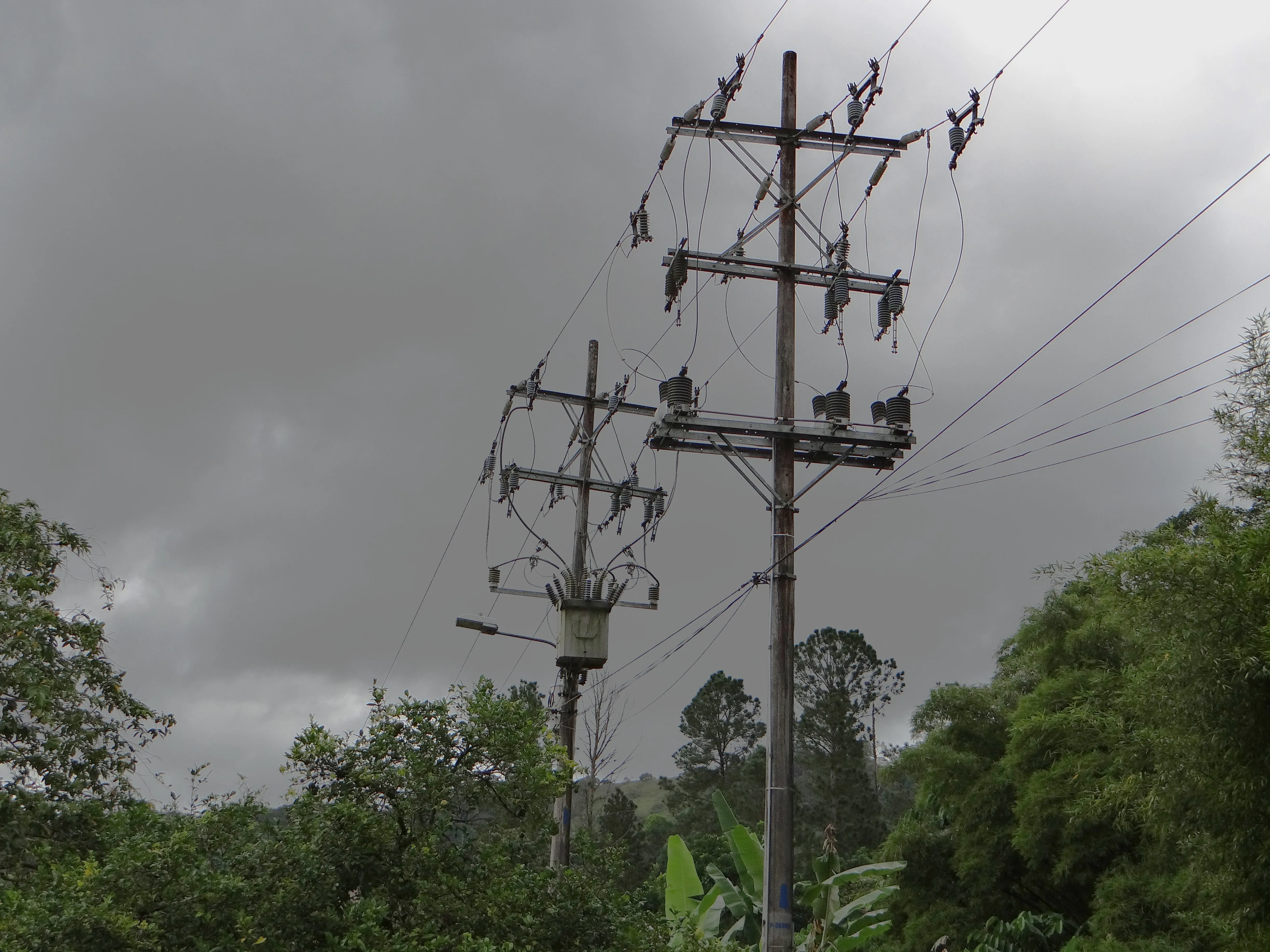 Electricity transmission infrastructure against a stormy sky in Latin America